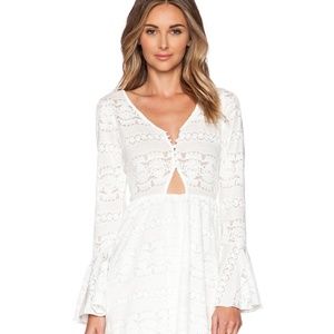 White bell sleeved dress